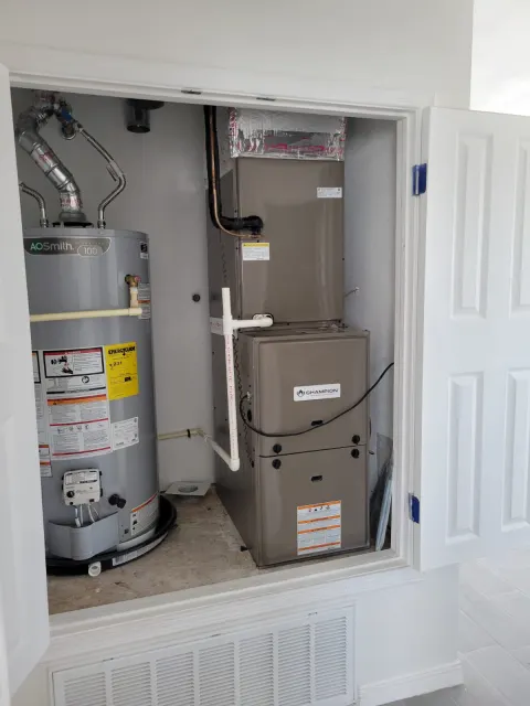 HVAC air handler installed in a residential utility closet